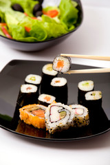 Japanese sushi on a black plate