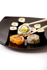 Japanese sushi on a black plate