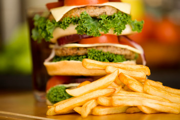 Huge hamburger with french fries