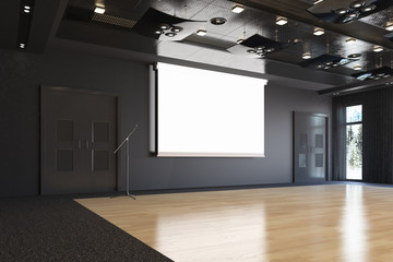 Projection hall with projection screen on stage. Art gallery. Free space for advertising.