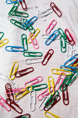 a group of colorful paper clips textured on white background