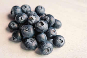 blueberries on wood white background