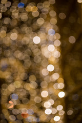 Texture of Christmas lights garlands in blur. Background of holiday lights