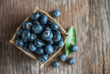 Fresh blueberries on wood