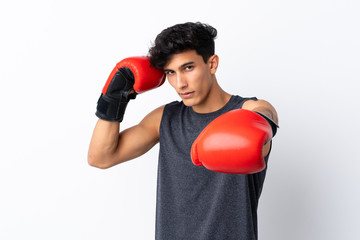 Young Argentinian sport man over isolated white background with boxing gloves