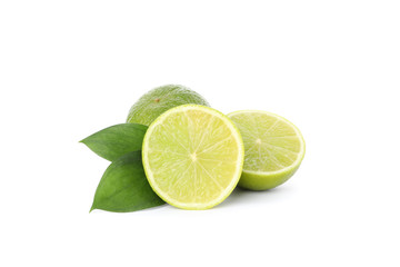 Limes with leaves isolated on white background. Juicy fruits