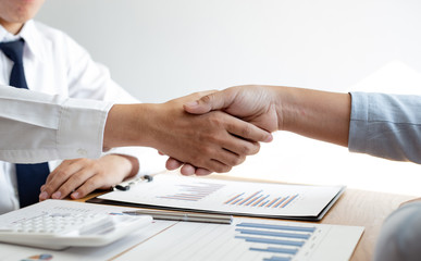 Successful ,The image of business women and men shake hands, Shaking hand concept.