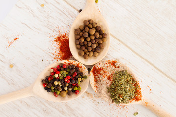 Mixed spices on the wooden spoons