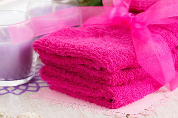 Pink face towels and candles