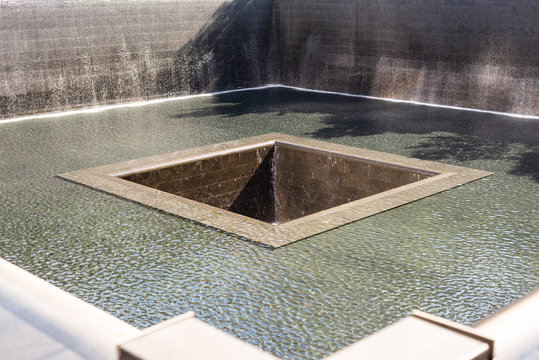 Square hole within the reflecting pools in the 9/11 Memorial, New York City. Taken on September the 25th, 2019