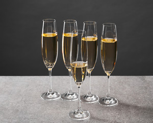 champagne in glasses for celebrating christmas eve on grey