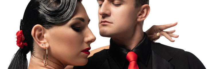 Obraz premium panoramic shot of passionate couple of dancers performing tango isolated on white
