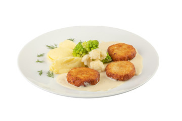 Beef cutlet served with mashed potatoes, broccoli and cauliflower in a white plate