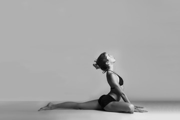 Girl doing yoga poses, poster ready, artistic black and white photo, fitness yoga instructor  