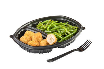 meat nuggets and asparagus in disposable dishes isolated on white background