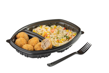 Thai cuisine mix fried chicken nuggets with rice in a plastic bowl isolated on white background.