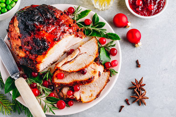 Christmas Glazed Ham with cranberry sauce. Roasted Holiday Pork Meat.