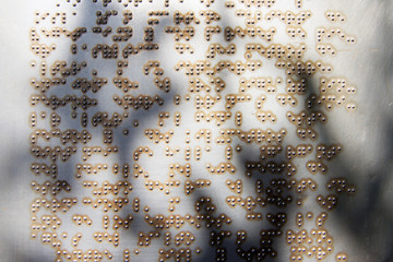 Braille Text in Silver Metal Sign