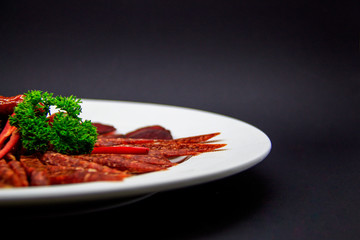 Plate of sun-dried sausages. Mahan, wasabi, chili