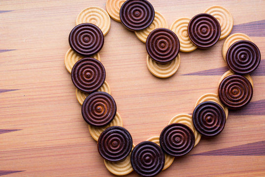 heart from chekers on wooden background