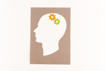 top view of human head silhouette with gears isolated on white