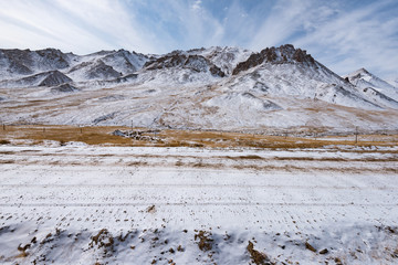 the gravel road on the snow mountain