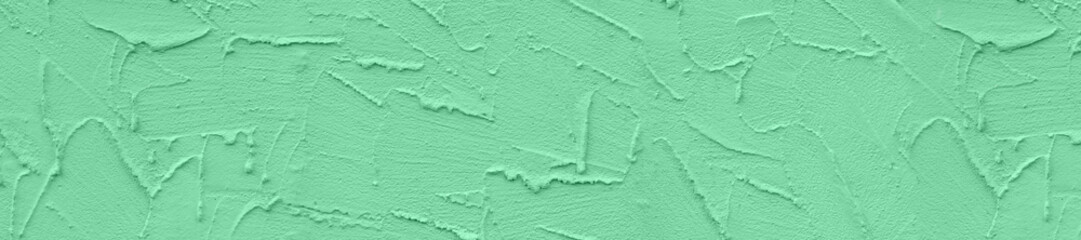 Panorama rough light green color textured concrete background.