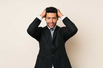 Young handsome businessman man over isolated background with surprise facial expression