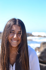 Young woman portrait at the sea side, summer time