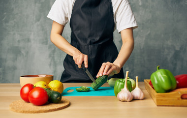 young woman cutting vegetables