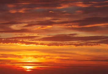 Fototapeta na wymiar Beautiful bright sunset with multi-colored dramatic clouds