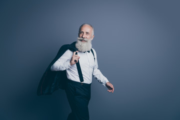 Portrait of his he nice attractive cool rich wealthy cheerful cheery gray-haired man walking to job...
