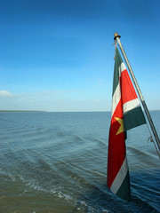 Surinam flag on river boat