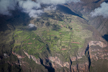  Forests, fields, clouds over mountains in Sacred Valley in Cusco.
