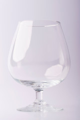 Glass on a white background. Glass on a white isolated background. Glass for alcoholic drinks.