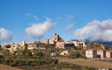 Fototapeta na wymiar Village landscape topped by stone bell tower in Laguardia, Spain