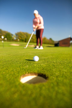 Professional woman golf player playing golf competition / match, professional sport concept
