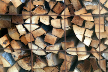 Pile of stacked logs, ready for winter. Selective focus.