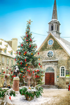 Quebec, Canada - December 21, 2016: Christmas tree on Rue du Petit-Champlain at 21 December, 2016 in Quebec City, Quebec, Canada. Historic District of Quebec City.