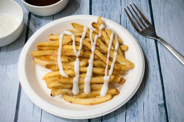French fries on a white plate.