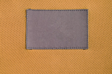 laundry care clothing label patch on polyester fabric jersey sport texture