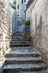 stone stairs on a narrow street in the town of Perast, Montenegro