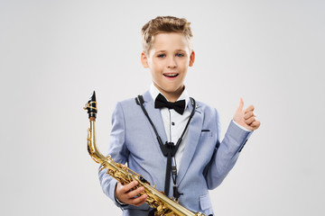 Fototapeta premium boy with saxophone