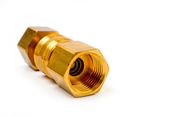 Close-up pneumatic quick coupling made of high-quality yellow metal, close-up shot on a white background