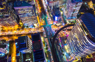 Top view city , Aerial view road , Expressway with car lots in the city in Thailand. Beautiful Street at downtown.Road roundabout.