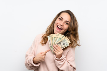 Young blonde woman taking a lot of money