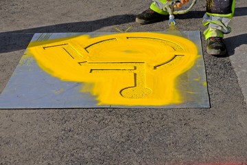 Yellow handicap parking sign spraying on the floor. 