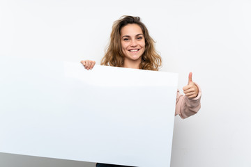 Young blonde woman holding an empty white placard for insert a concept