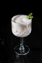 Cocktail Pina Collada. Garnished with a leaf of mint.