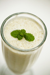 Smoothie in glass with mint leaves 